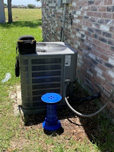 Too Cool Air HVAC maintenance on an outdoor heat-pump system