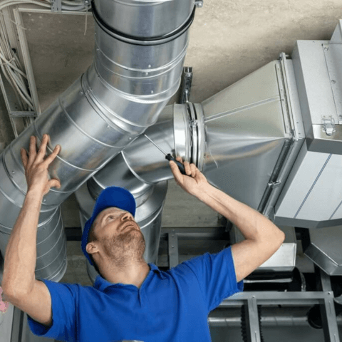 HVAC Contractor Checks Air Ducts.